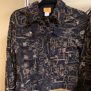 Black jacket/beige stitching. Very artsy.